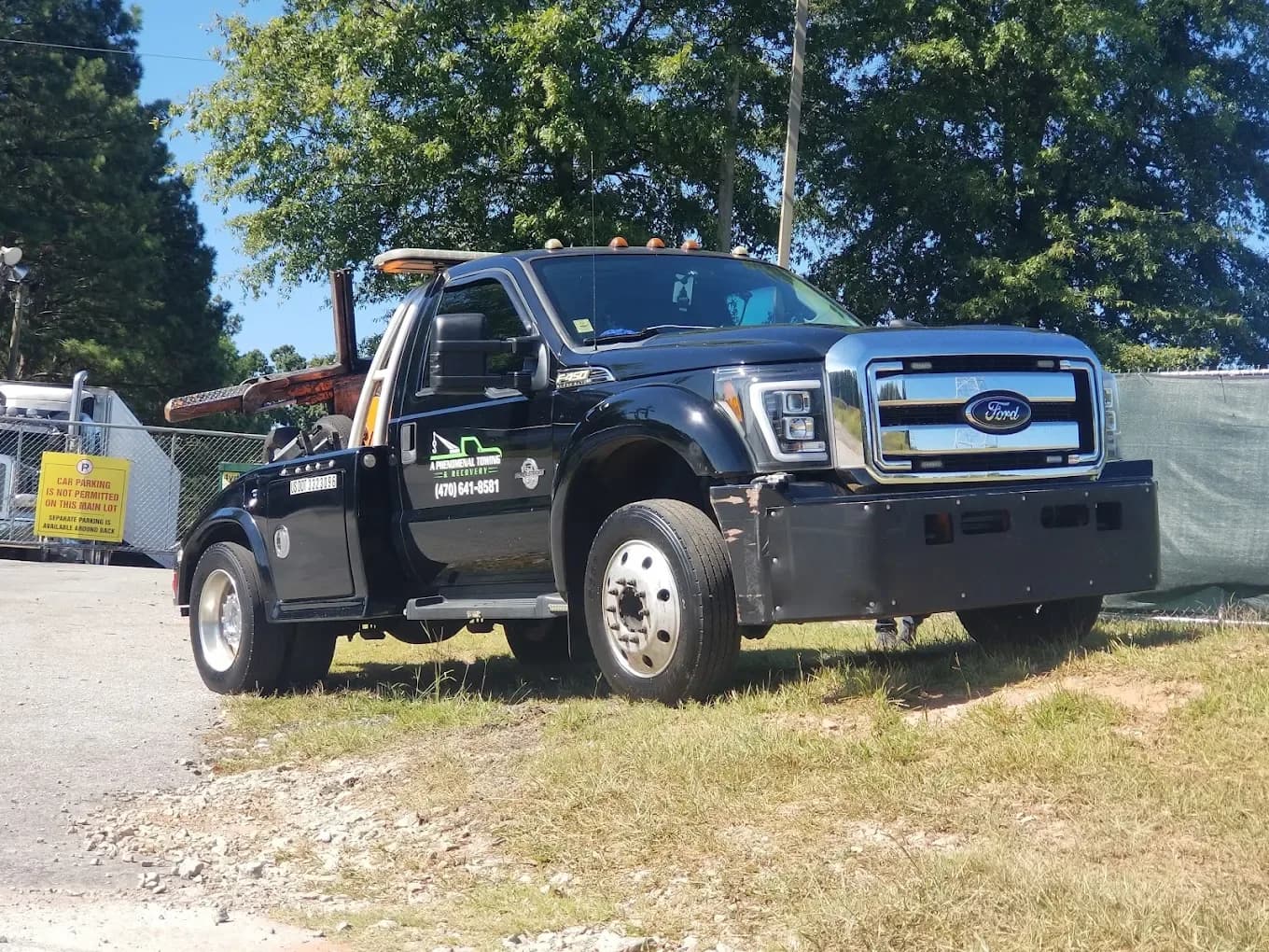 APT-branded heavy-duty tow truck