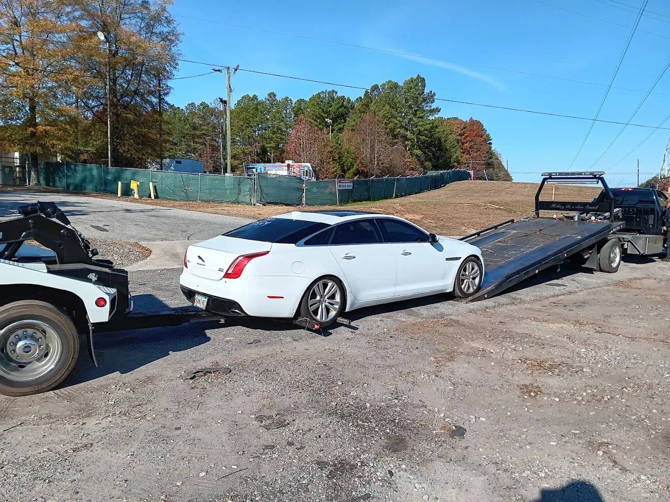 Jaguar sedan on a flatbed